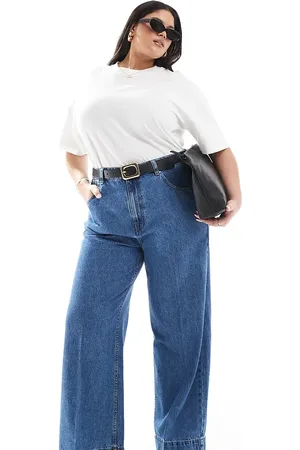 ASOS ASOS DESIGN Curve - Jeans met wijde pijpen en plooi aan de voorkant in donker middenblauw