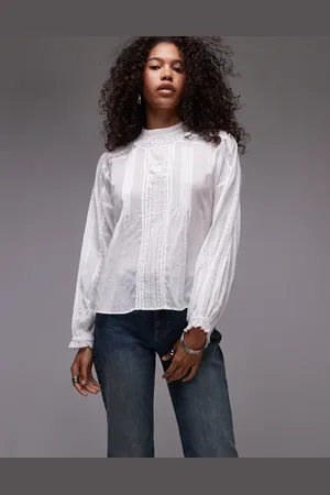 MANGO Hoogsluitende doorschijnende blouse in