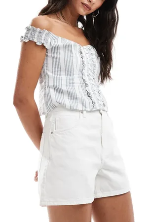 MANGO Ruimvallende denim short met lange pasvorm in