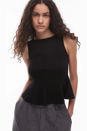 MANGO Mouwloze top met structuur en peplumzoom in