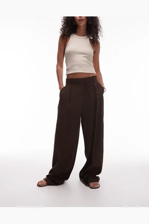 MANGO Ruimvallende geplooide pantalon in chocoladebruin