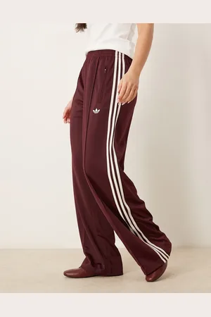 adidas Firebird - Losse trainingsbroek in bordeauxrood