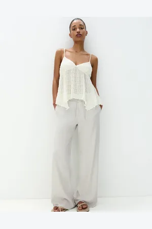 Pull&Bear Broek met wijde pijpen, gestrikte taille en gerafelde zoom in