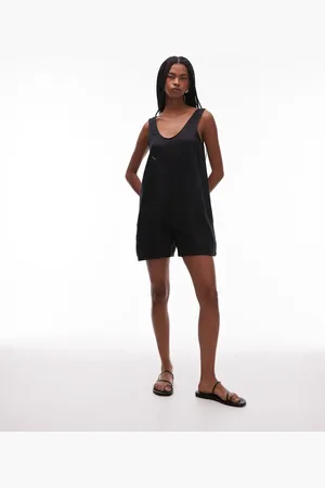 ARKET Strandplaysuit van puur linnen met diepe V-hals en zakdetail in