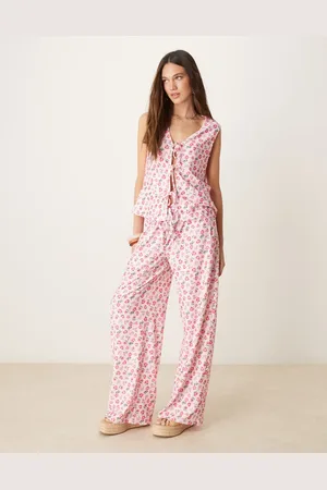 ASOS Broek met wijde pijpen en gestrikte voorkant in met fijne bloemenprint