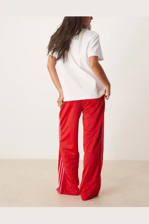 adidas Firebird - Losse trainingsbroek in en roze