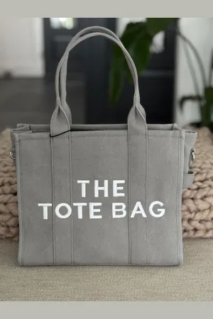 Merkloos Damestas - The Tote Bag - Canvas - Geborduurde Letters - - Witte letters - 33 x 27 cm.