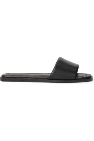 Kazar Slip-on black mules on a flat sole