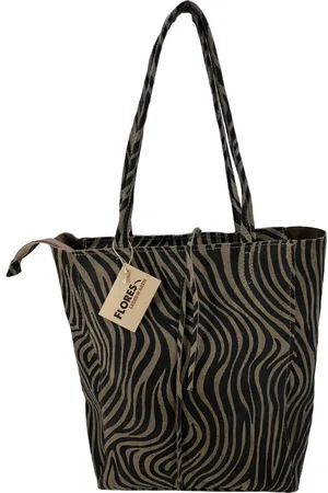 Merkloos Wildleren shopper met afsluitbare rits bovenin en in de binnenkant een ritsvak.