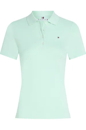 Tommy Hilfiger De Polo 1985 van is een stijlvolle damespolo met een opstaande kraag, knoopsluiting en korte mouwen