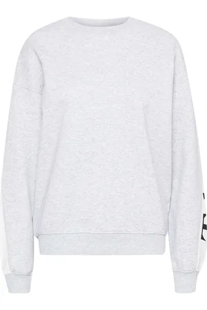 TheJoggConcept De Sweater Saja Logo van is een casual dames sweater met een grafisch patroon