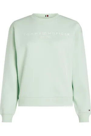 Tommy Hilfiger De Sweater Corp Logo van is een stijlvolle dames sweater met lange mouwen