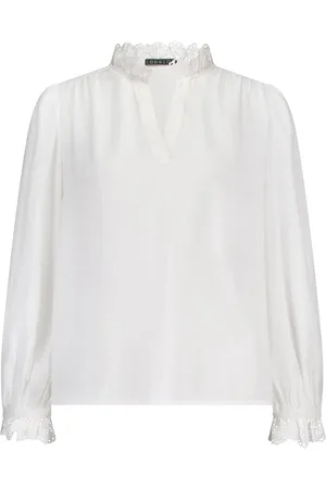 Label Dot De Blouse Aura van is een stijlvolle dames blouse met een elegante V-hals en lange mouwen