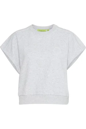 TheJoggConcept De Top Saja Piping van is een casual fit dames top met een ronde halslijn en korte mouwen