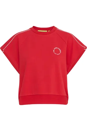 TheJoggConcept De Top Saja Piping van is een casual fit dames top met een ronde halslijn en korte mouwen