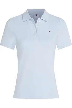 Tommy Hilfiger De Polo 1985 van is een stijlvolle damespolo met een opstaande kraag, knoopsluiting en korte mouwen