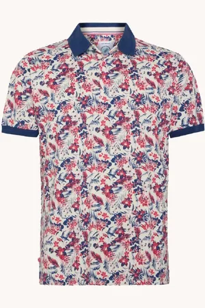 A fish named fred De Polo Floral van is een casual heren polo met een levendig bloemenpatroon