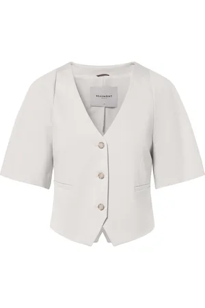 beaumont De Blazer Babs van is een stijlvolle tussenjas met een button down kraag, korte mouwen en een getailleerde pasvorm