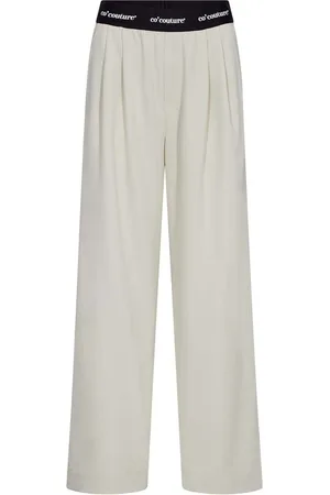 Co`Couture Pantalon Amina van is een stijlvolle pantalon met een elastische tailleband voor comfort