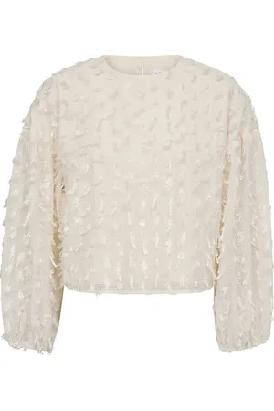 Co`Couture De Blouse Fozzy van is een trendy dames blouse met een opstaande kraag en lange mouwen met elastische manchetten