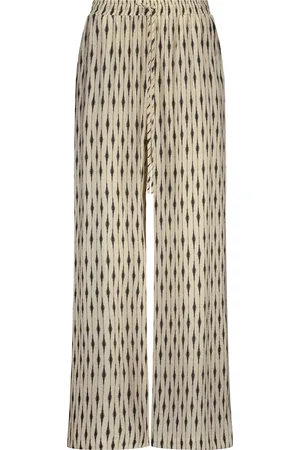 Label Dot De Pantalon Raf van is een stijlvolle dames pantalon met een uniek grafisch patroon