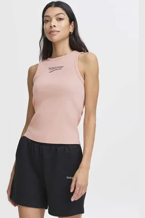 TheJoggConcept Ontdek de Tanktop Rasa van , een stijlvolle en sportieve dames top mouwloos met een ronde hals en effen patroon