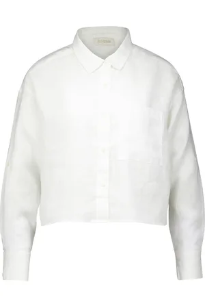 JcSophie De blouse van is een minimalistische casual blouse met button-down kraag, voorzakken en lange mouwen met knoopmanchetten