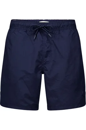 Shiwi De broek van is een effen heren zwemshort met een elastische taille en een koordsluiting