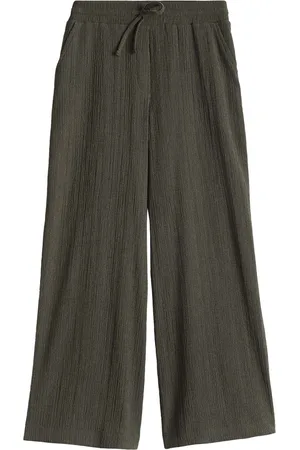 Opus De broek van is een dames lange broek met een hoge taille en een comfortabele wijde pijp