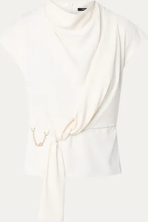 NIKKIE. Imani top met knoopdetail en watervalhals