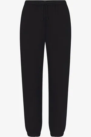 SKIMS Cotton Fleece mid waist tapered fit loungebroek met steekzakken