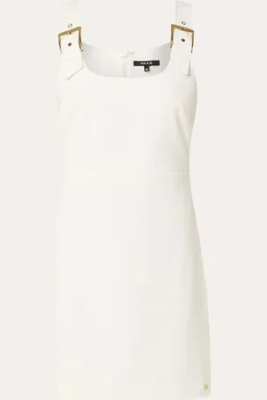 NIKKIE. Ibiza mini jurk met gespdetail