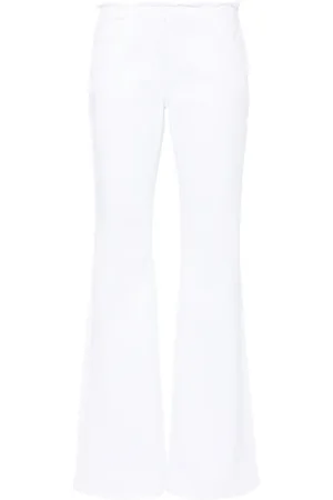 Givenchy Low waist flared jeans met gerafeld detail