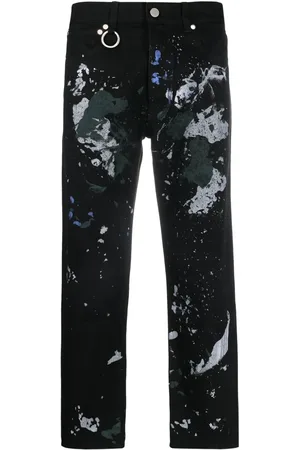 Etudes Jeans met verfspatten