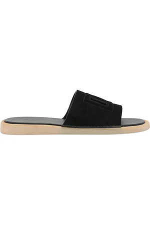 Dolce & Gabbana Suède slippers met uitgesneden logo