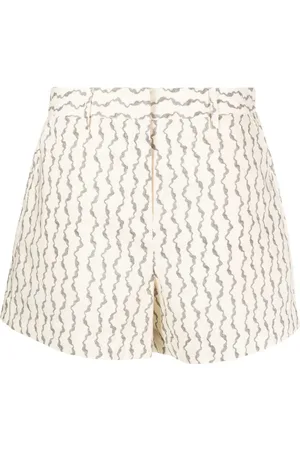 REMAIN Shorts met abstracte print