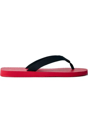 The Row Slippers met logo