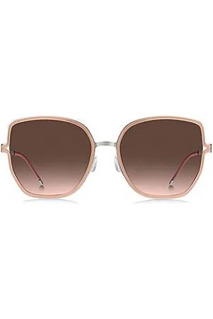 HUGO BOSS Zonnebril met nudekleurig montuur, cut-out poten en merkketting