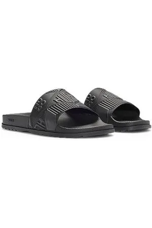 HUGO BOSS In Italië vervaardigde slippers met verschillende logo’s