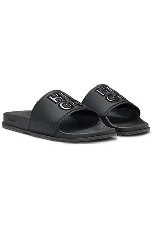 HUGO BOSS Slippers van rubber met tweedelig reliëflogo