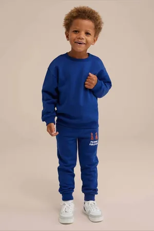 WE Fashion Slim fit broek met printopdruk kobalt blauw Jongens Katoen Printopdruk