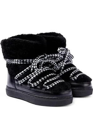 INUIKII Curly shearling and leather ankle boots