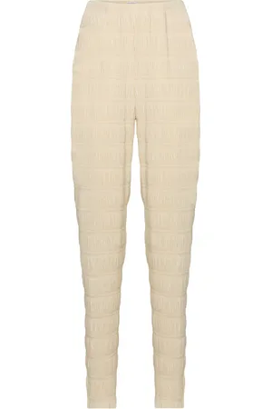 Totême Smocked high-rise slim pants