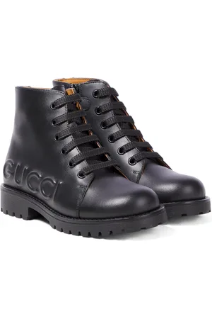 Gucci Logo embossed leather boots