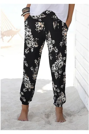 Lascana Strandbroek met subtiele bloemenprint, soepelvallende jersey broek, zomerbroek