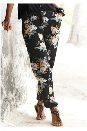 Lascana Strandbroek met bloemenprint en zakken, jersey broek, zomerbroek