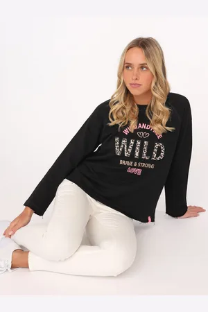 Zwillingsherz Sweater "Wild and Free" met used-look randen, leo-details en borduursel