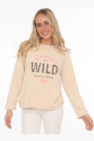 Zwillingsherz Sweater "Wild and Free" met used-look randen, leo-details en borduursel