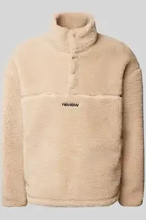 Review Sherpa jacket met labelpatch