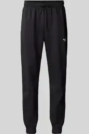 The North Face Regular tapered fit sweatpants met labelprint